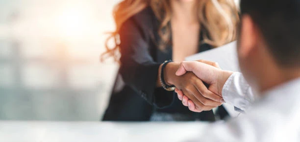 Man and a woman shaking hands