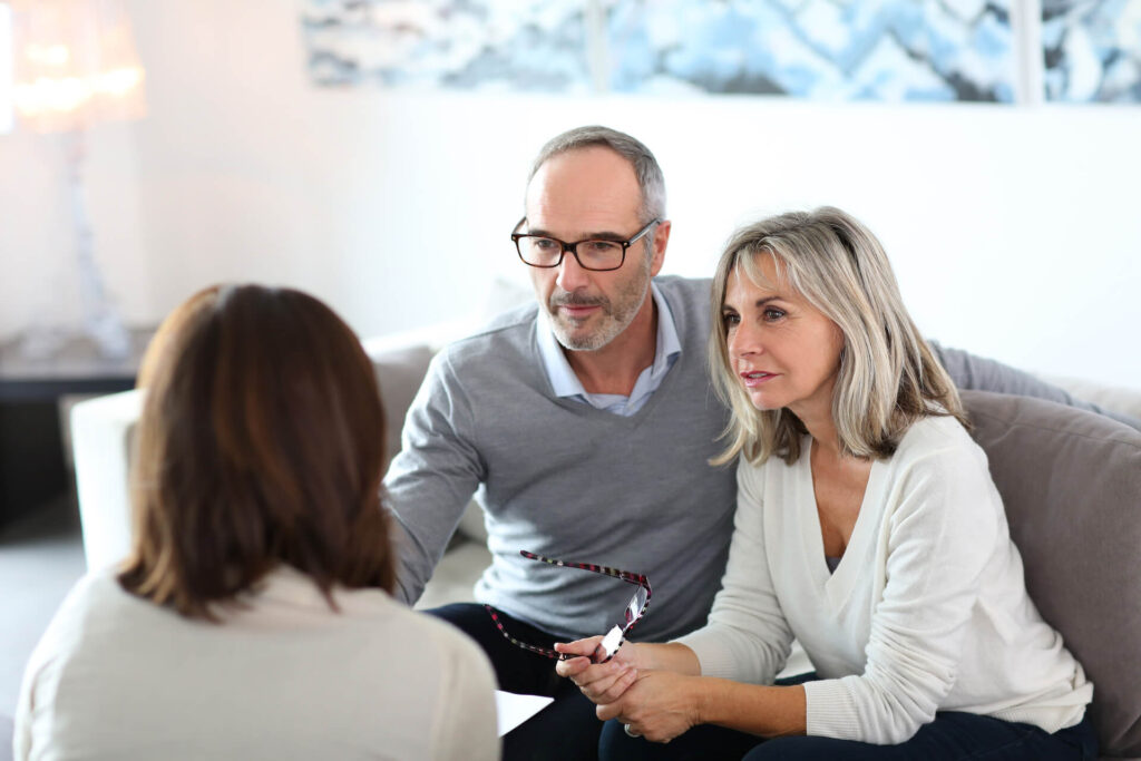 Man and woman consulting with a woman