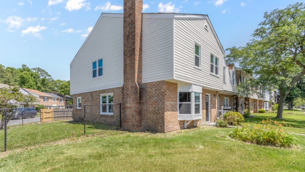 Side and front view of a home in Norfolk, VA that we bought