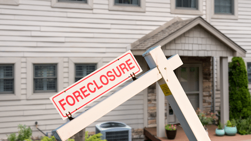 Foreclosure sign in front of a house