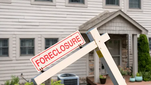 Foreclosure sign in front of a house