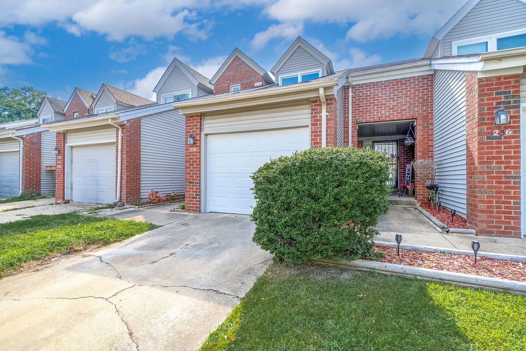 The front of a brick row home in Chesapeake