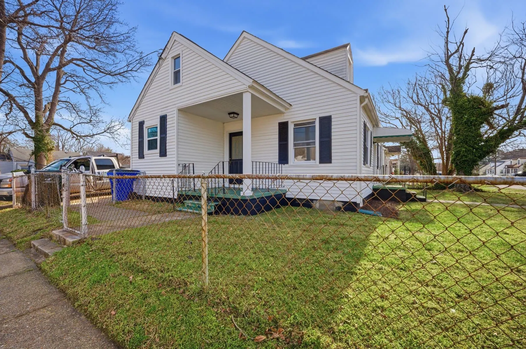 Side of a white home that we bought in gloucester