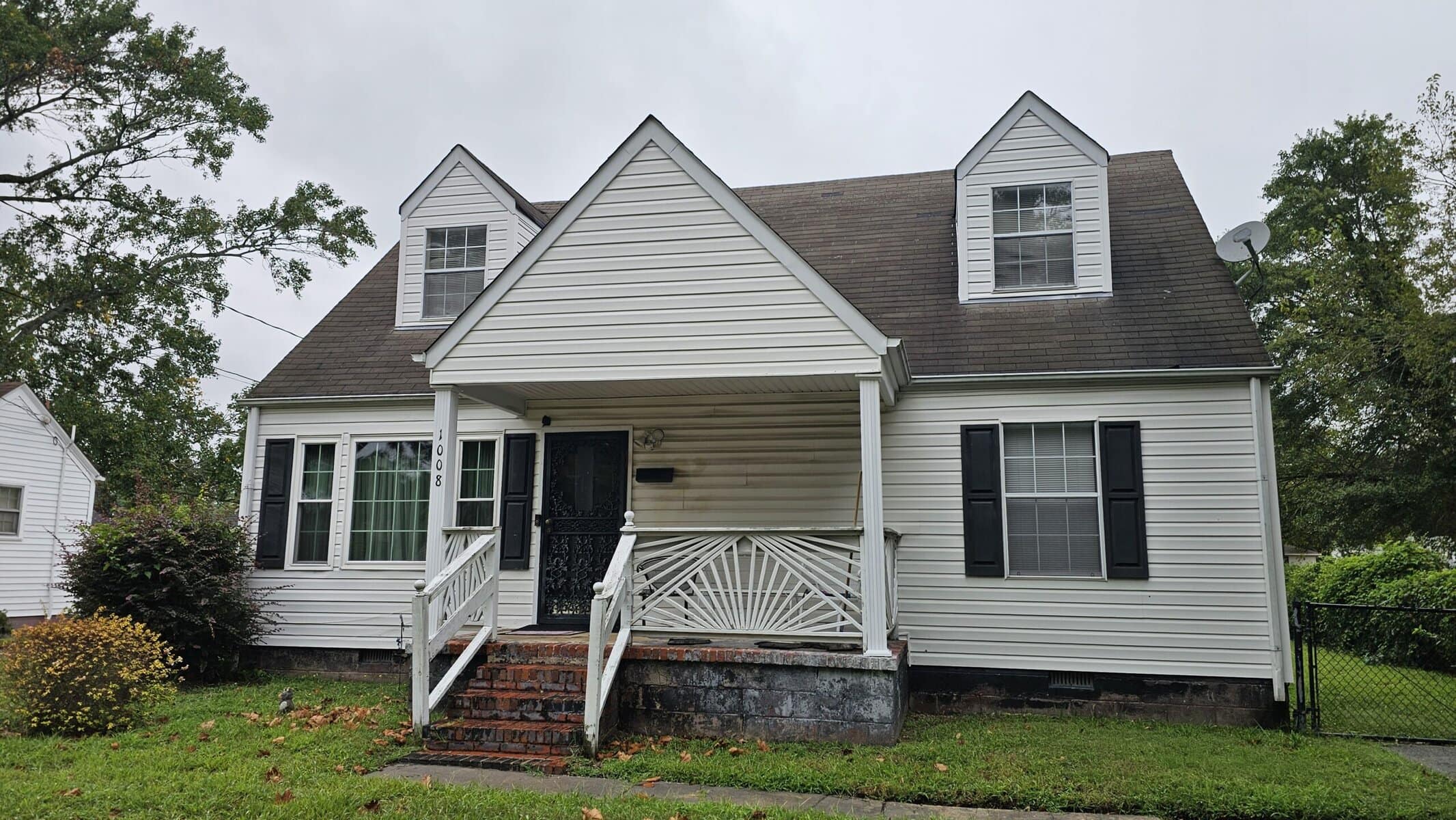 Front of a white house in Cape Charles that we bought